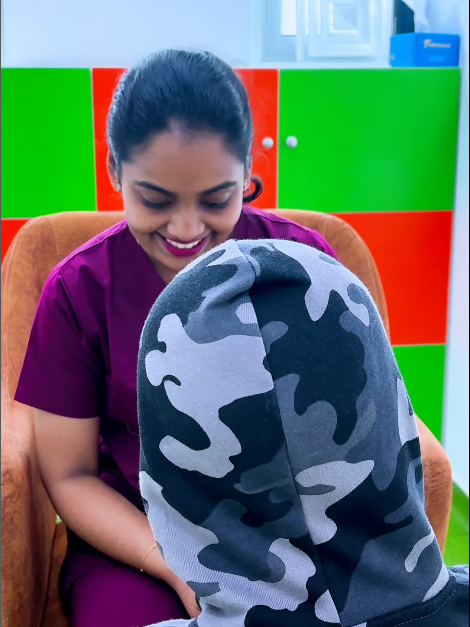 Therapist smiling and engaging with a child at the best special education center Dubai, promoting emotional bonding and developmental growth.