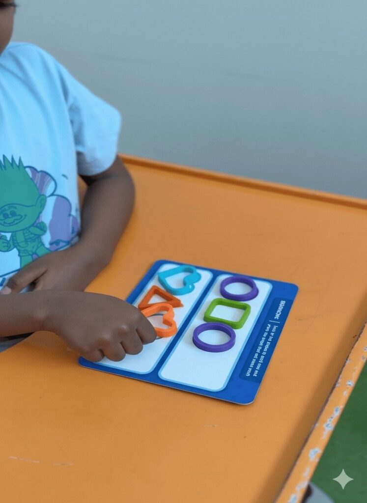 Child engaging in a shape recognition activity at Jewel Autism and Child Development Center, the best speech therapy center in Dubai.
