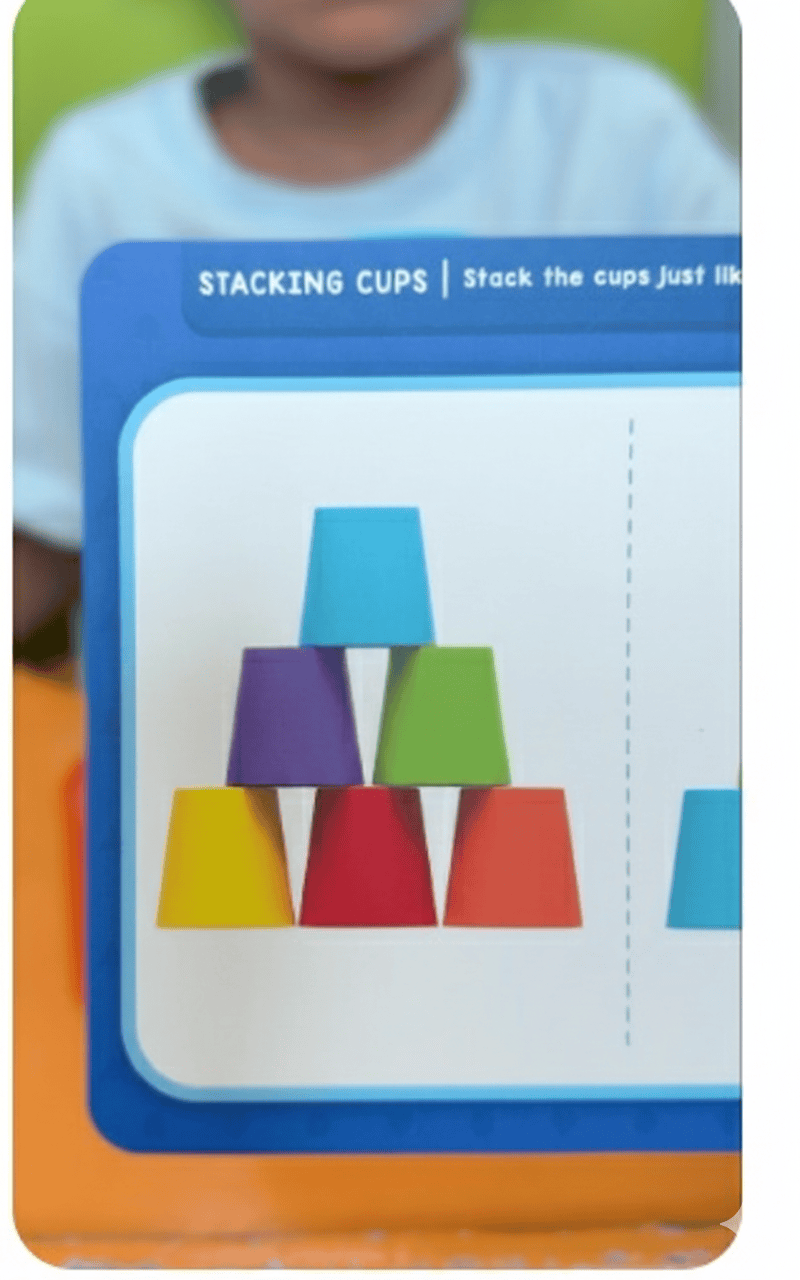 Child practicing stacking activity using colorful cups at Jewel Autism and Child Development Center, the best speech therapy and child development center in Dubai.